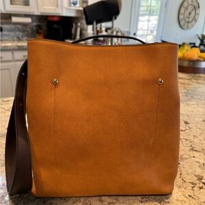 Barely used women’s tote/handbag. Dimensions are 11” L, 11”h, 6w